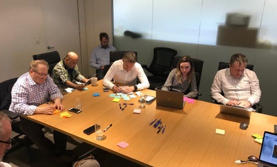 Staff members kicking-off project with post-it notes